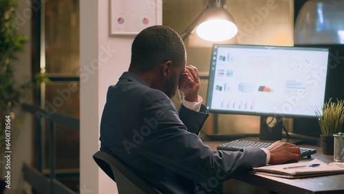 Pissed off computer operator fed up with loud colleague listening to music and pretending to beat drums at work. Businessman annoyed by bothersome coworker perturbing him in office