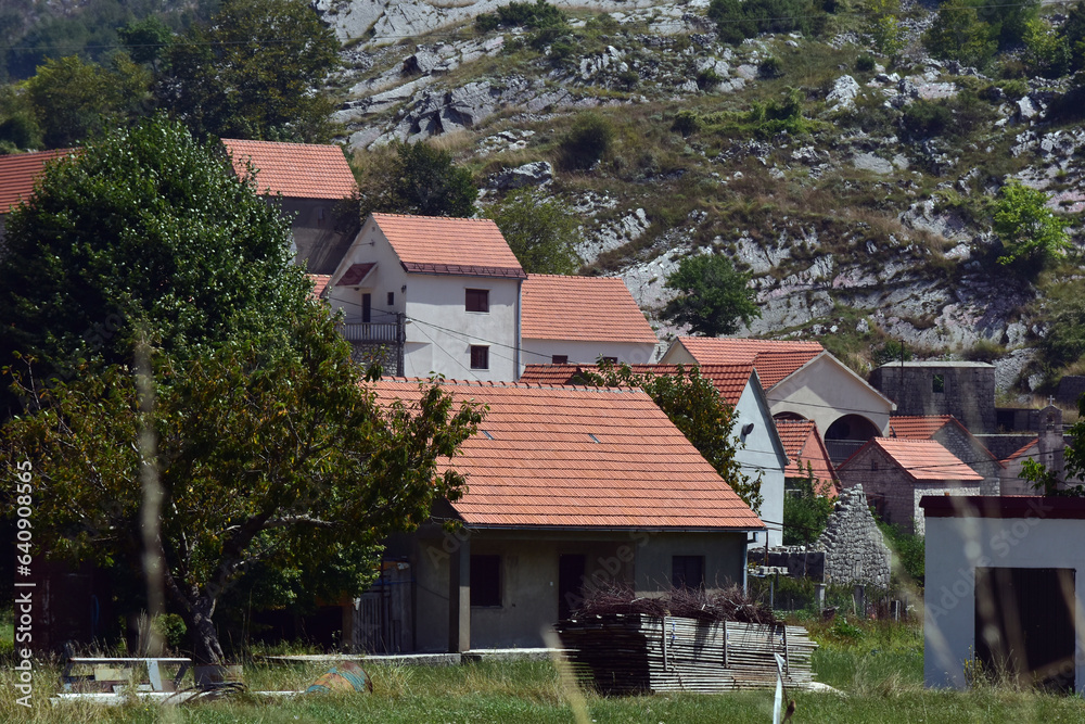Small stone village in Montenegro. Old village on countryside of Njegusi, Montenegro. Rural scenery on a sunny day. Small stone village in Montenegro. Old village on countryside of Njegusi, Montenegro. Rural scenery on a sunny day.