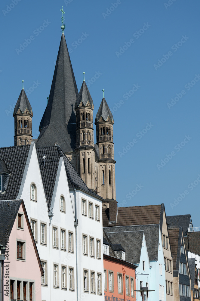 view from the rhine to the narrow old town houses and the church of great st martin in cologne city center