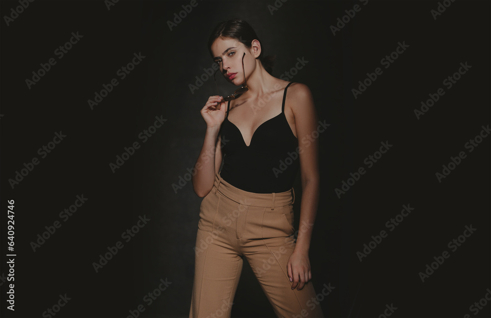 Fashion shot. Vogue model posing at studio. Collection of fashion clothes. Model in style trends dress. Fashion shot. Vogue model posing at studio. Collection of fashion clothes. Model in style trends dress.