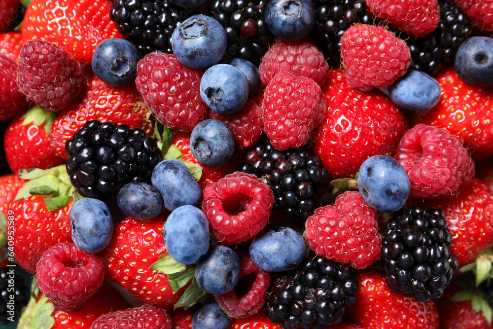 Many different fresh ripe berries as background, top view Many different fresh ripe berries as background, top view