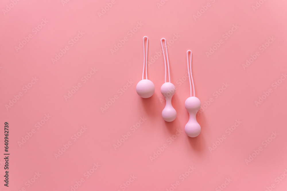 Pink balls for special exercises for woman. Balls for intimate muscles of women. Kegel balls for strenthening the pelvic floor muscles, vaginal muscles. Mock up. Close up Pink balls for special exercises for woman. Balls for intimate muscles of women. Kegel balls for strenthening the pelvic floor muscles, vaginal muscles. Mock up. Close up