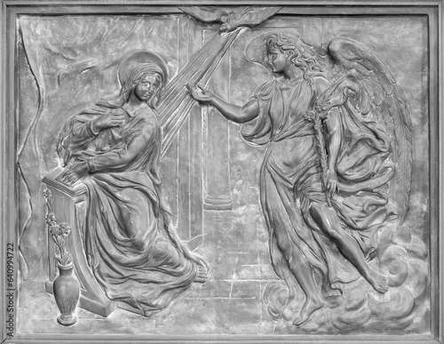 NAPLES, ITALY - APRIL 22, 2023:  The bronze relief of Annunciation on the gat...