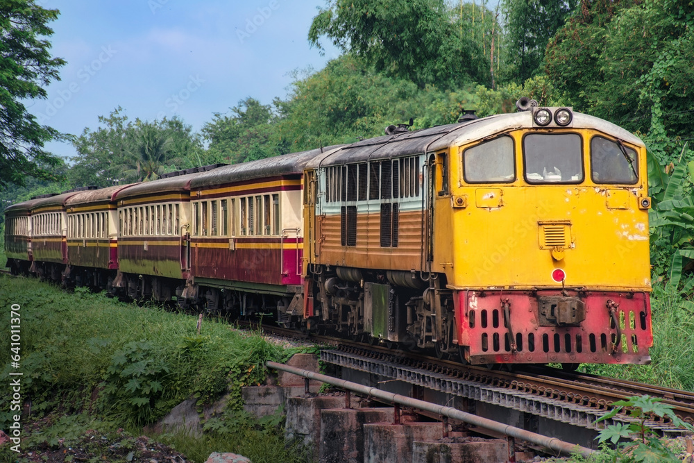 Passenger train by diesel locomotive on the railway. Passenger train by diesel locomotive on the railway.