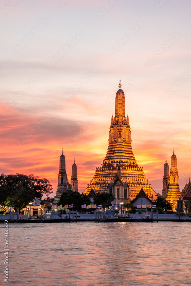 Wat Arun Temple during Sunset at Chao Praya River Bangkok, Thailand.