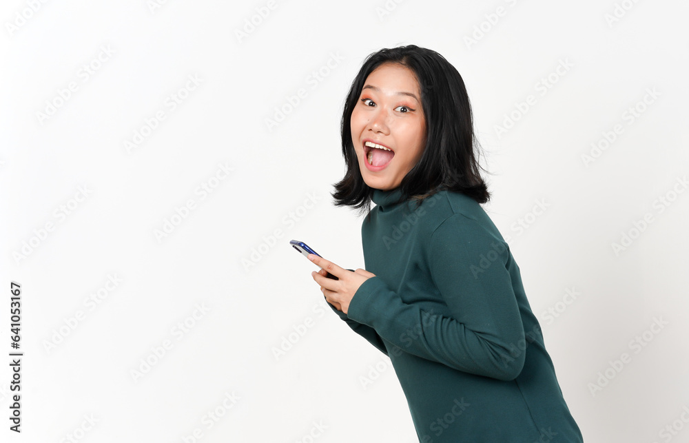 Holding Smartphone and happy smiling looking camera Of Beautiful Asian Woman Isolated On White Background Holding Smartphone and happy smiling looking camera Of Beautiful Asian Woman Isolated On White Background