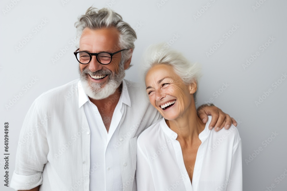 Beautiful gorgeous 50s mid age elderly senior model couple with grey hair laughing and smiling. Mature old man and woman close up portrait. Healthy face skin care beauty, skincare cosmetics, dental. Beautiful gorgeous 50s mid age elderly senior model couple with grey hair laughing and smiling. Mature old man and woman close up portrait. Healthy face skin care beauty, skincare cosmetics, dental.