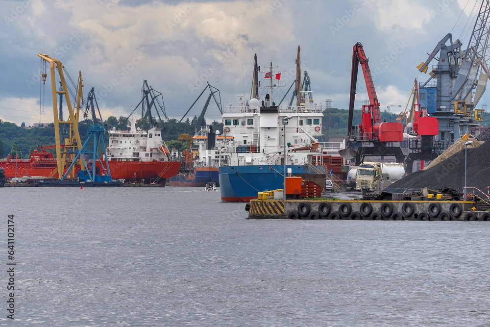 Ships gathered in the Port of Gdansk during unloading and loading. Port of Gdansk, Poland