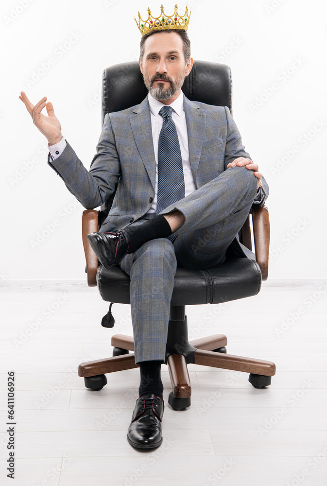 successful businessman leader in office chair. motivation and reward. selfish businessman boss in suit. leadership concept. business leader man in crown. big boss. business success and leadership successful businessman leader in office chair. motivation and reward. selfish businessman boss in suit. leadership concept. business leader man in crown. big boss. business success and leadership