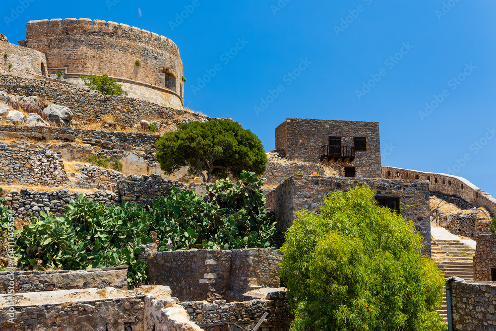 Abandoned ruins of a former Venetian fortress and leper colony during a hot, dry summer (Spinalonga, Crete)
