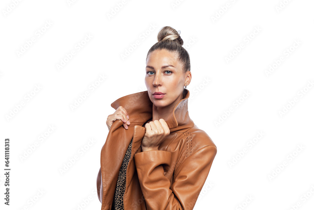 Beautiful woman in a fashionable brown leather coat. Seasonal fashion and style. Close-up. Isolated on white background.