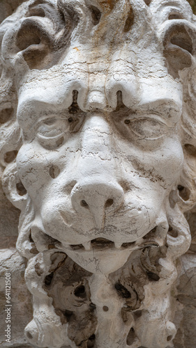 Venice, Italy - Ancient building decoration element of a scary lion head in Venice historical and touristic downtown, details. Concept of conservation of historical heritage