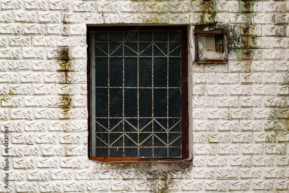 A window in an old abandoned building