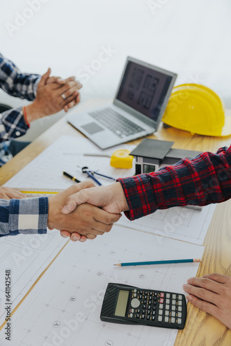 Engineer team meeting Real estate agents and construction team leaders work together. See home design and renovate house plans. Construction projects, mortgages, rent, buy, sell, buy houses