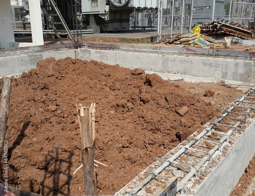 The pile of soil is prepared to be compacted and compacted.