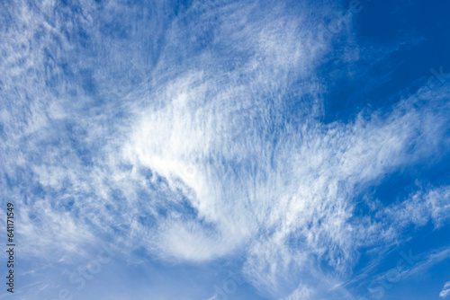 Beautiful blue sky. White cirrus clouds. Cloud landscape. Photo for the background