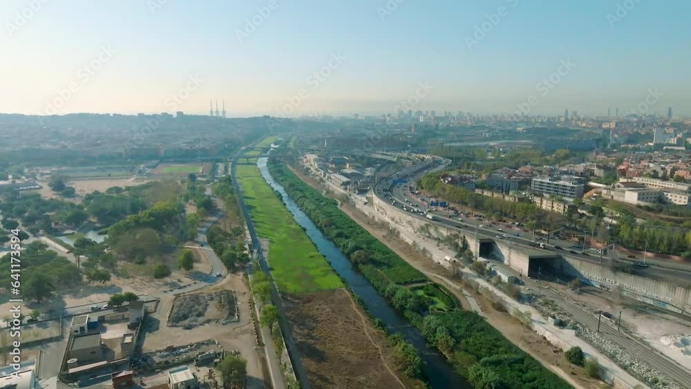 Aerial drone view of Besos river next to Barcelona. Green park with urban landscape. Aerial drone view of Besos river next to Barcelona. Green park with urban landscape.