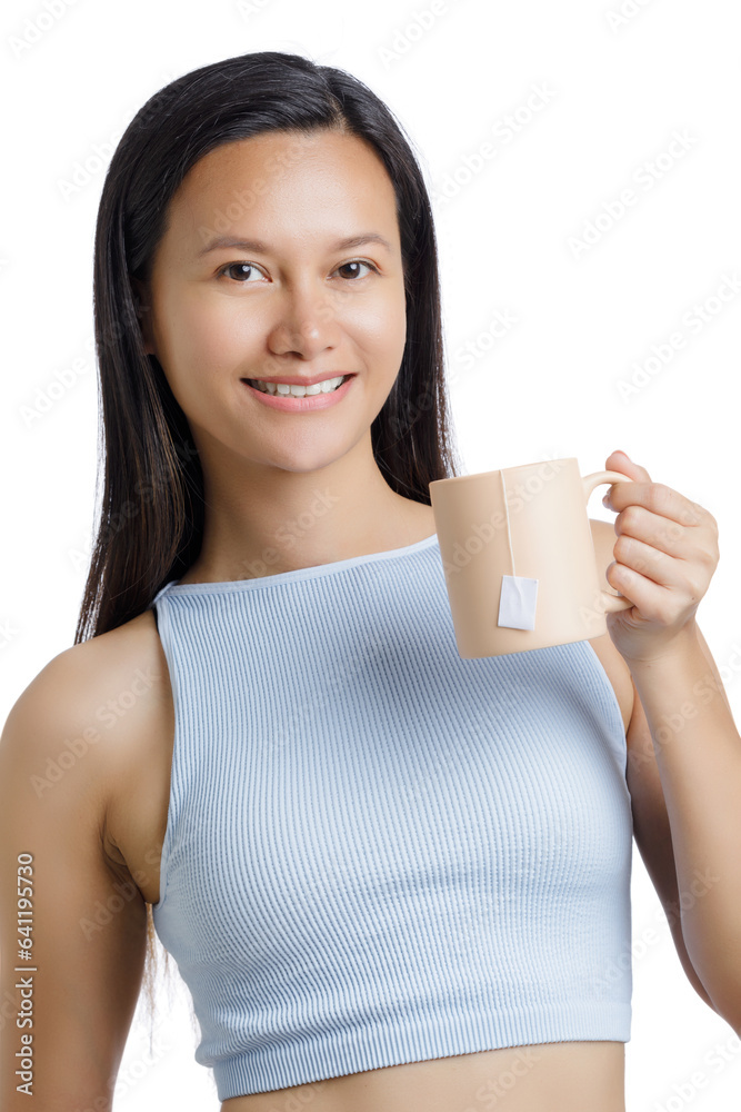 Asian Woman drinking a Healthy Tan Mug of Hot Tea Asian Woman drinking a Healthy Tan Mug of Hot Tea