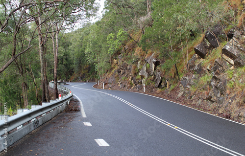 Gillies Highway road winding through the mountains with trees in Far North Queensland, Australia photo