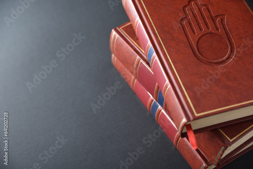 Canvas Print Stack of books with engraved symbol jain elevated view