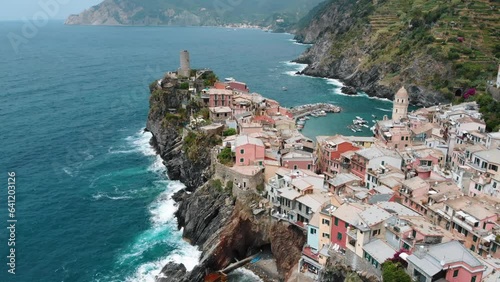 Aerial view of Vernazza, the beautiful and famous Cinque Terre town. Summertime daylight drone shot. built on a high rock, one of the most charming and romantic of the Liguria, Northern Italy