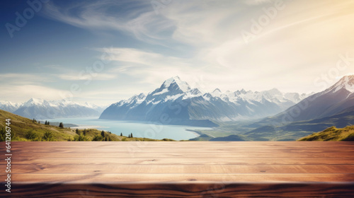 Empty wooden table top with blur background of mountain landscape © tashechka