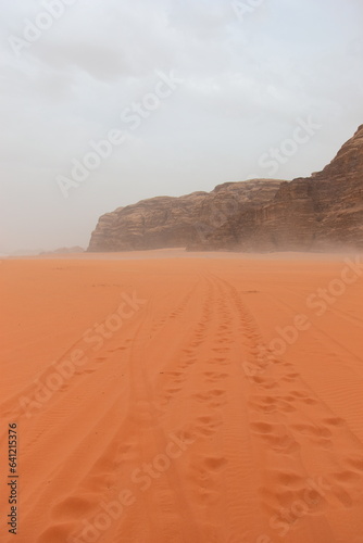 Wadi Rum Desert  Jordan. The red desert and Jabal Al Qattar mountain. 8th July 2023. On a hot spring cloudy day. 