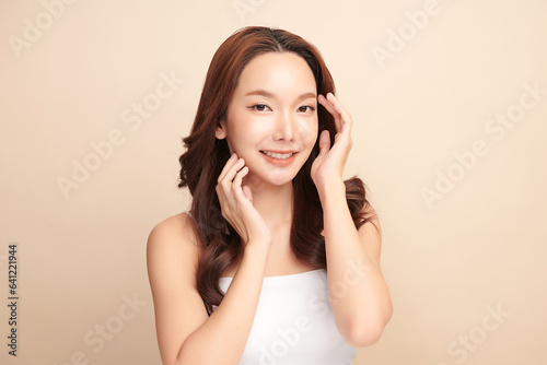 Beautiful young asian woman with clean fresh skin on beige background, Face care, Facial treatment, Cosmetology, beauty and spa, Asian women portrait.