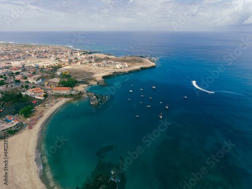 Fototapeta Naklejka Na Ścianę i Meble -  Aerial drone Tarrafal in Santiago Island, Cabo Verde showcase golden beaches, azure waters, and rugged mountains, it's a paradise for nature lovers. The charming town, historic sites