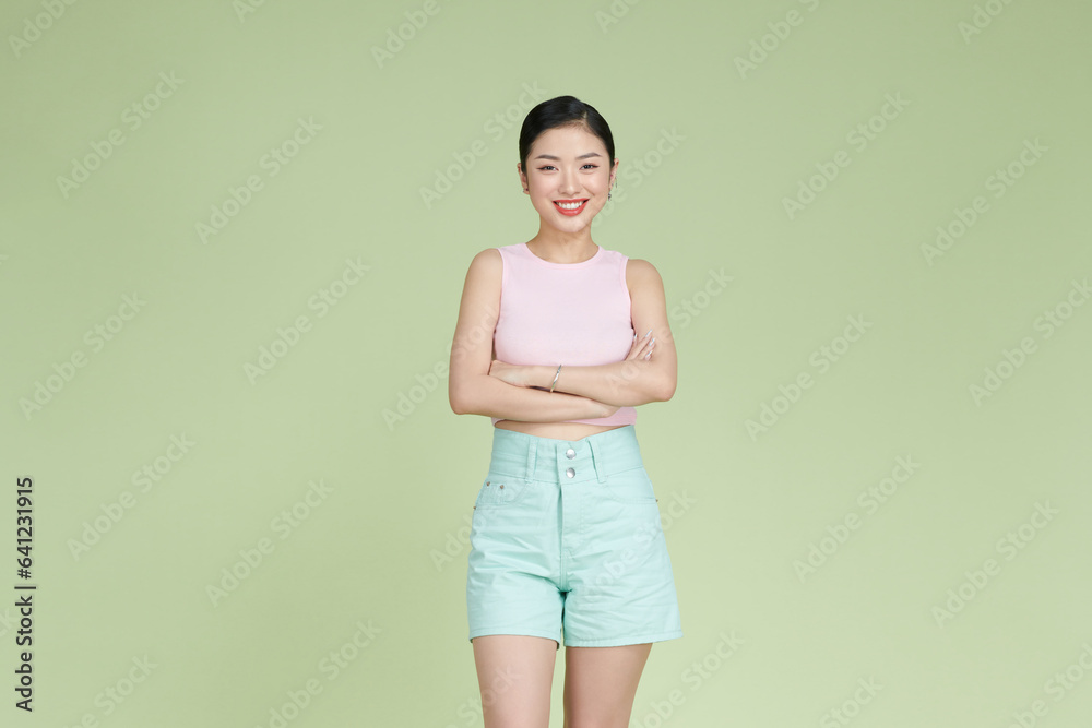 Photo of dreamy confident young woman looking empty space arms crossed smiling Photo of dreamy confident young woman looking empty space arms crossed smiling
