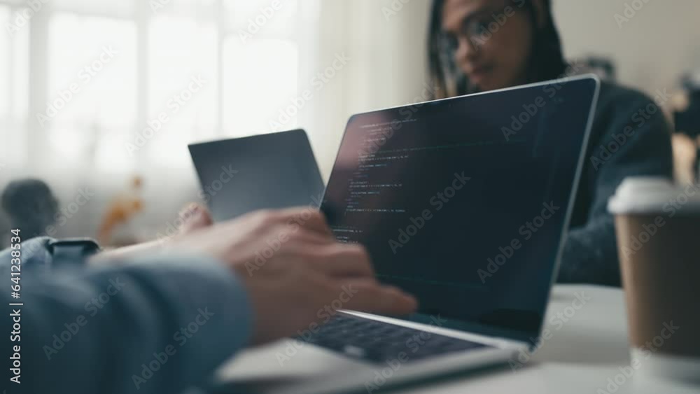 IT specialists working in office, creating computer programs, typing in code IT specialists working in office, creating computer programs, typing in code
