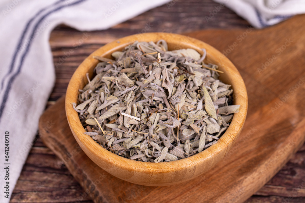 Dry Sage leaves. Dried salvia or sage leaves in wood bowl. herbal medicine. Close up Dry Sage leaves. Dried salvia or sage leaves in wood bowl. herbal medicine. Close up