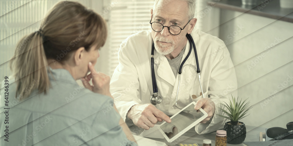 Obraz premium Doctor showing reports on digital tablet to his female patient, geometric pattern