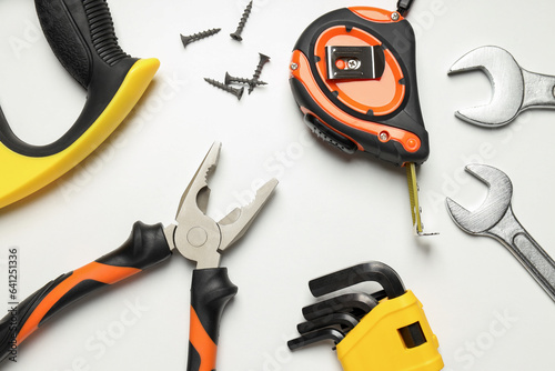 Construction tools on white background, top view
