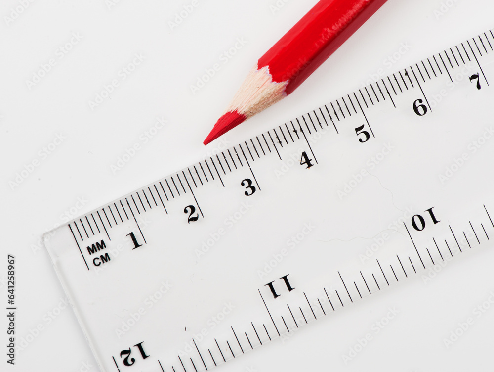 school background with transparent ruler and red pencil school background with transparent ruler and red pencil