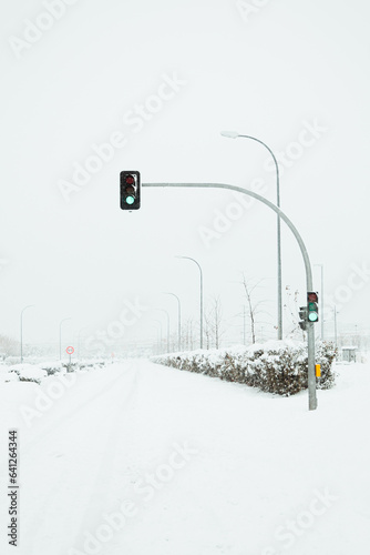 Green traffic light on snowy road