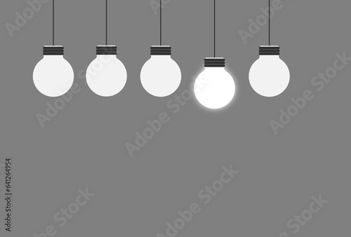 Bulbs hanging on a wall with one bulb turned on motivation being different vector design 