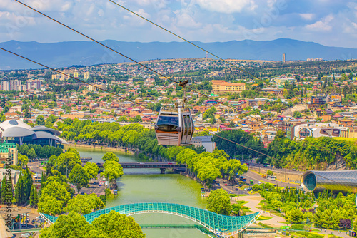 Cable car cabin and arial view of Tbilisi, Georgia photo
