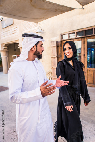 Photography Middle eastern couple of lovers wearing traditional emirati clothing dating outd