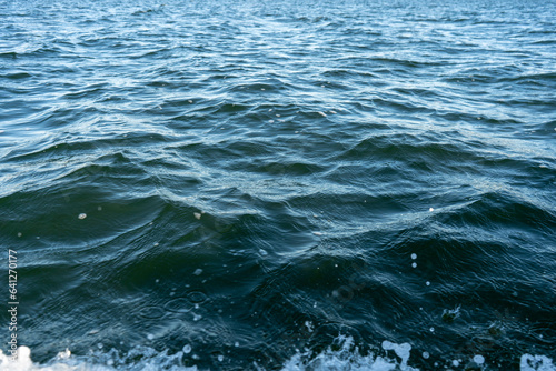 blue water body in a lake with a small waves in