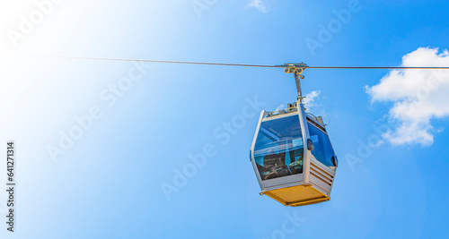 Cable car cabin against the blue sky close-up