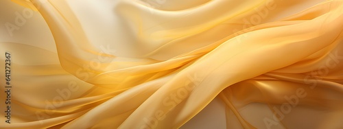 Texture, yellow-gold silk translucent fabric with pleats, abstract background, fabric pattern.