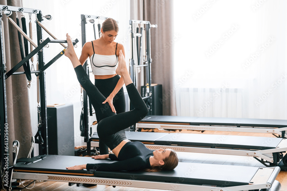 Women in fitness center are doing exercises Women in fitness center are doing exercises