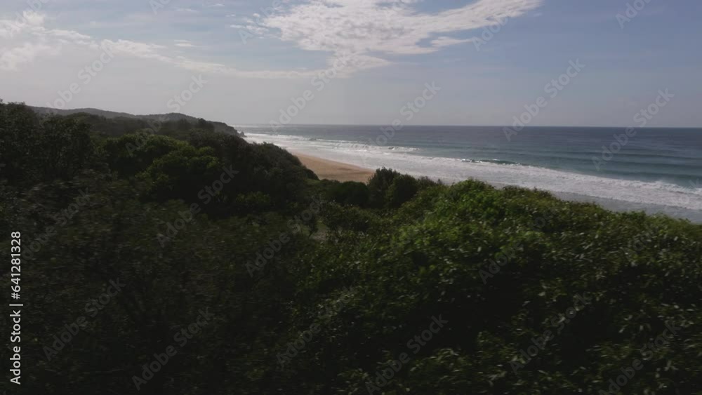 Drone reveal shot of empty Gillard's beach next to dense vegetation. Victoria, Australia Drone reveal shot of empty Gillard's beach next to dense vegetation. Victoria, Australia