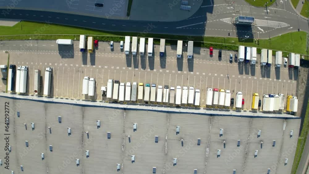 Aerial view of distribution center, drone photo of industrial logistics zone,new super modern logistics center full of modern technology and robotics,roof solar power plant for green energy production Aerial view of distribution center, drone photo of industrial logistics zone,new super modern logistics center full of modern technology and robotics,roof solar power plant for green energy production