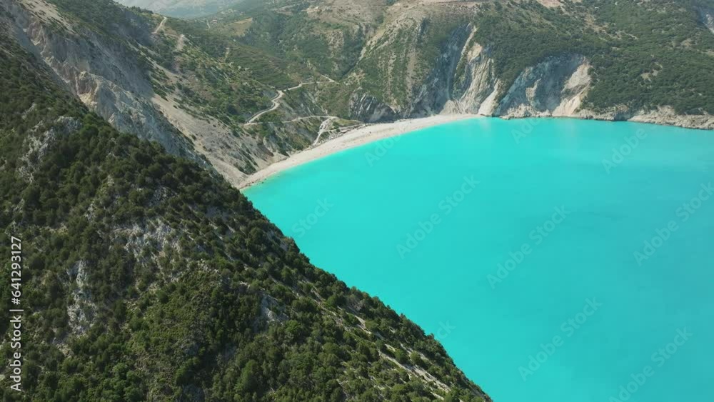 Stunning views of Myrtos Beach surrounded by rocky mountains and turquoise colored water, Greece Stunning views of Myrtos Beach surrounded by rocky mountains and turquoise colored water, Greece