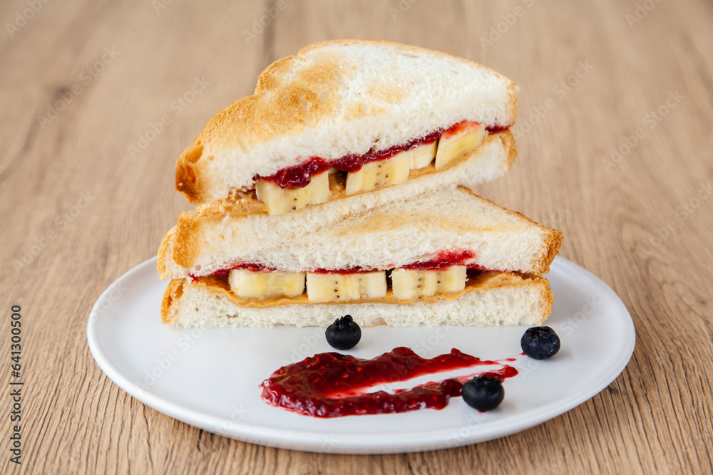peanut butter and jelly sandwich with banana and fresh blueberry
