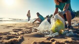 Group of eco volunteers picking up plastic trash on the beach - Activist people collecting garbage protecting the planet - Ocean pollution, environmental conservation and ecology concept