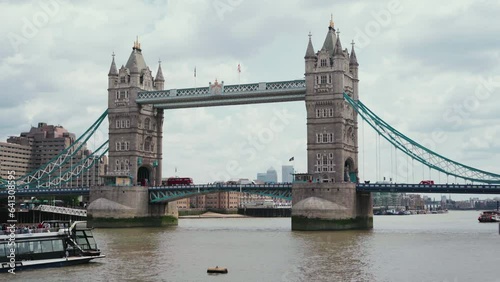 view of Tower Bridge from the side of the river in London, UK