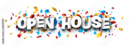 Open house sign with colorful cut out foil ribbon confetti background.